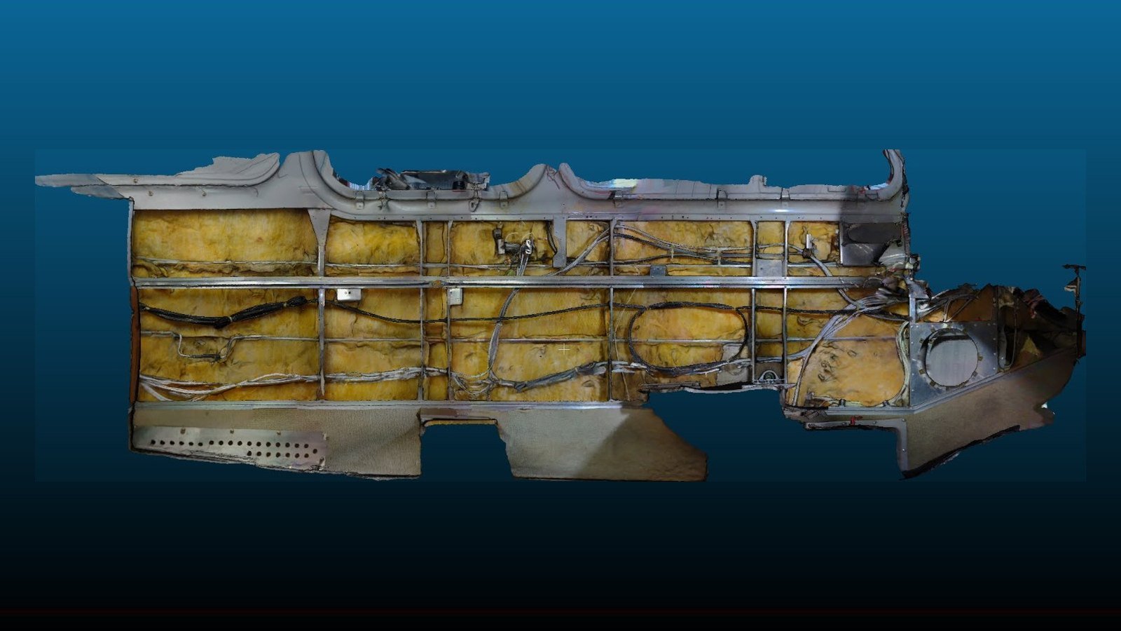 Full-color 3D scan of the inside left cabin wall of a Beechcraft Bonanza P35, showing the frames, stringers, insulation and wiring